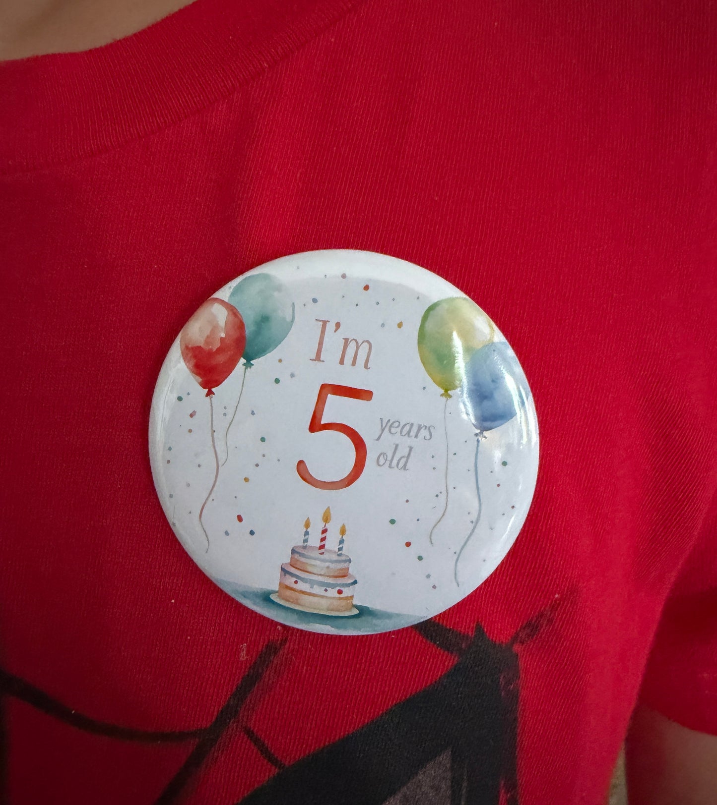 Custom birthday pin front view with balloon and cake design – 2.25" round pin by Field of Magnets